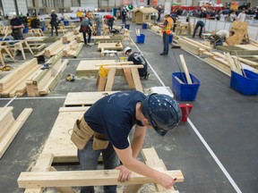 Bradley Ginter of Jasper Place High School works on the floor of his project during the Provincial Skills Canada competition at the Edmonton Expo Centre on May 10, 2017. Photo by Shaughn Butts / Postmedia