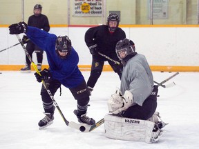 Lewis Boulton makes a save against teammate Aidan Prueter during the London Jr. Knights minor midget "AAA" practice in early 2017. The new Ontario Hockey Prospects Cup will bring 'AAA' midget aged players together and in the eyes of Junior level hockey teams. (DEREK RUTTAN, The London Free Press)