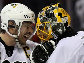 Sidney Crosby and goalie Marc-Andre Fleury of the Pittsburgh Penguins celebrate following the Penguins 2-0 win over the Washington Capitals in Game 7 at Verizon Center on May 10, 2017 in Washington, DC. (Patrick Smith/Getty Images)