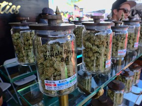Large jars of marijuana are on display for sale at the Cali Gold Genetics booth during the High Times Cannabis Cup in San Bernardino, Calif., on April 23, 2017. The Vermont Legislature became the first in the U.S. to vote to legalize the recreational use of marijuana. (AP Photo/Richard Vogel)