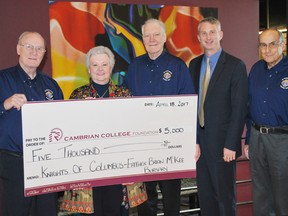 Jim Cook, left, a trustee with the Knights of Columbus Father Brian McKee Council 1387, Darlene Palmer, Cambrian Foundation director of development, Richard Rivard, advocate of Father Brian McKee Council, Bill Best, Cambrian College president, and Tony Sottile, chancellor of Father Brian McKee Council, were on hand for the donation to the Father Brian McKee Bursary. Supplied photo