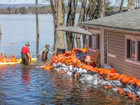 Sandbags try to keep the flood waters at bay.