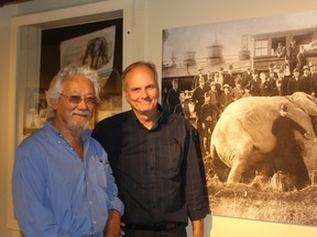 David Suzuki and Mike Baker, Elgin County Museum curator, stand beside an enlarged photo of Jumbo in the museum's exhibit on the legendary elephant. Suzuki was in town on Wednesday to film part of his show The Nature of Things, which will feature the history of Jumbo. Laura Broadley/Times-Journal