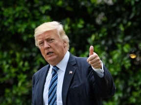 U.S. President Donald Trump gives the thumbs-up as he makes his way to board Marine One on the South Lawn of the White House in Washington, DC on May 4, 2017. Trump was headed to New York, NY. (MANDEL NGAN/AFP/Getty Images)