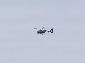 Huron County & South Bruce OPP officers, along with members from the West Region Tactics and Rescue Unit (TRU), Emergency Response Team (ERT) & Canine Unit are actively containing two properties in Huron-Kinloss and Ashfield-Colborne-Wawanosh Township. Police helicopters could be seen overhead and officers had barricaded the roads to the farm in Ripley, seen here. (Ryan Berry/Kincardine News and Lucknow Sentinel)