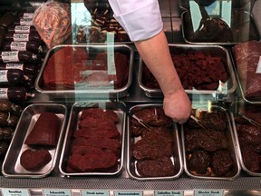 A butcher arranges different sorts of horse meat on sale at his shop in Bremen, northern Germany in this February 14, 2013 file photo. (INGO WAGNER/AFP/Getty Images)