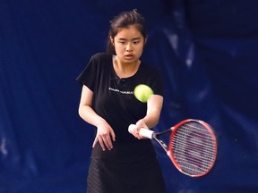 Connie Zeng, of Lo-Ellen Park Secondary School, returns a volley during the girls high school singles final at the Sudbury Indoor Tennis Centre in Sudbury, Ont. on Thursday May 11, Zang won the title. 2017. John Lappa/Sudbury Star/Postmedia Network