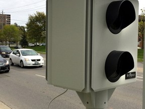 This red-light camera at Springbank Drive and Wonderland Road will start operating Monday. Seven other cameras come online in the next few weeks. (DEREK RUTTAN, The London Free Press)