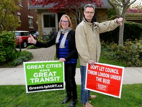 Ian and Juliana McLean have two different signs to reflect their differing opinions on the city?s proposed bus rapid transit system.  The disagreement between the Thornton Avenue couple ratcheted up when Juliana came home and found the anti-BRT sign on their front lawn. ?I am a very progressive person,? she says. (Morris Lamont/London Free Press)