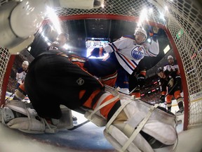 Connor McDavid of the Edmonton Oilers is pushed into John Gibson of the Anaheim Ducks during Game 7 of their Western Conference second-round playoff series at Honda Center on May 10, 2017, in Anaheim, Calif. (Sean M. Haffey/Getty Images)