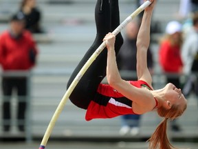 Katy Magoffin of Woodstock Collegiate rises up on her way to winning the girls pole vault by matching her personal best of 3.60 metres Thursday in the TVRA track and field meet at TD Stadium. (Mike Hensen/The London Free Press)