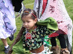 Evita Recollet, 3, takes part in a powwow at St. Charles College in Sudbury, Ont. on Thursday May 11, 2017. Students from St. Charles, St. Benedict Catholic Secondary School and three elementary schools from the Sudbury Catholic District School Board were invited to attend and participate in the celebration as part of Indigenous Education Week activities. John Lappa/Sudbury Star/
