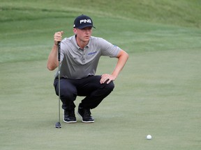 Mackenzie Hughes of Canada reacts on the 18th green during the first round of the THE PLAYERS Championship at the Stadium course at TPC Sawgrass on May 11, 2017 in Ponte Vedra Beach, Florida. (Photo by Jamie Squire/Getty Images)