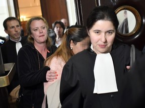 One of the victims (second from right) arrives to attend the so-called "Conrad princesses" trial in front of the Brussels criminal court for human trafficking, on May 11, 2017. United Arab Emirates' princess Sjeika Alnehayan and seven of her daughters are accused of mistreatment on 20 of their employees as they where living in one level of the Conrad hotel (now Steigenberger) in 2008. DIRK WAEM/AFP/Getty Images