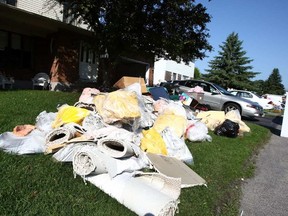 July 28, 2009—flood damaged belongings on Dudegan street in Kanata where sewage backed-up into residents' basements following a heavy downpour.  JANA CHYTILOVA / POSTMEDIA