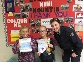 Constable Stephanie Leduc started the Mini-Mountain program at elementary schools in town. Pictured with her are Lexi Scott (left) and Madison James (middle) who are both attending Evergreen Elementary School and part of the Mini-Mountie program.
