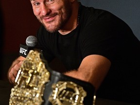 In this Sept. 10, 2016, file photo, Stipe Miocic speaks during a post fight press conference after his knockout win over Alistair Overeem, from the Netherlands, in a heavyweight title bout at UFC 203, in Cleveland. (AP Photo/David Dermer, File)