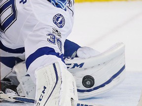 In this Feb. 11, 2017, file photo, then-Tampa Bay Lightning goalie Ben Bishop keeps his eyes on the puck as he makes a save against the Winnipeg Jets during the second period of an NHL hockey game, in Winnipeg, Manitoba. (John Woods/The Canadian Press via AP, File)