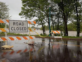 A road closure sign is placed along the banks of the Meramec River on May 4, 2017 in Fenton, Missouri. (Michael B. Thomas/Getty Images)