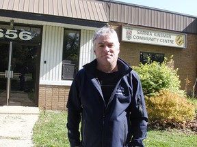 Patrick Marcella stands at the former Kinsmen Centre property, by Baxter Park in Sarnia. Marcella and a group of neighbours are suggesting a fundraising campaign to restore or rebuild the property, rather than sell it for new residential development. (Tyler Kula/Sarnia Observer)