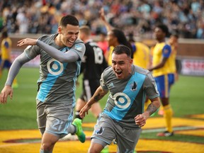 Minnesota United’s Christian Ramirez (left) and teammate Miguel Ibarra celebrate a goal against the Rapids. United FC won that game and also last weekend against Sporting KC. (AP)
