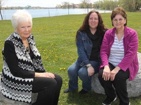 Gerry Wein, Donna Hughes and her daughter Angela Brown at Molly Brant Point Park in Kingston on Friday. Wein and Hughes are part of the Ontario Police Moms campaign established by the Police Association of Ontario.  (Steph Crosier/The Whig-Standard)