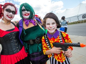 Dantée Baptiste as Harley Quinn, (from left), Alysha Lee as Joker and Michelangelo Baptiste as Henchman head into the annual Ottawa Comiccon event underway at the EY Centre.  Wayne Cuddington/Postmedia