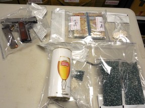 A handgun, cash and drugs were found in a bust by RCMP in Countryside South Nov. 23, 2016. (Supplied)