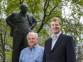 Duncan Sandys (right) , the great grandson of former British Prime Minister Winston Churchill, and Randy Barber, President, International Churchill Society of Canada pose for a photo by the statue of the late Churchill at City Hall in Toronto, Ont. on Friday May 12, 2017. (Ernest Doroszuk/Toronto Sun)