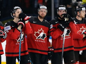 Canada’s players show their dejection after a loss to Switzerland in the AccorHotels Arena in Paris Saturday, May 13, 2017. (AP Photo/Petr David Josek)