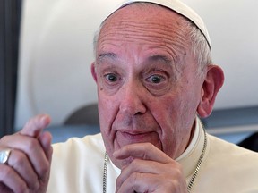 Pope Francis addresses journalists during the traditional press conference on his flight back to Rome, following a two-day visit at Fatima, Portugal, Saturday, May 13, 2017.  (Tiziana Fabi/Pool Photo via AP)