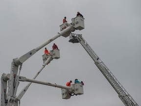 Bucket trucks took people high above the Get Ready in the Park as part of Emergency Preparedness Week on May 13, 2017 in Hawrelak Park in Edmonton. Photo by Shaughn Butts / Postmedia