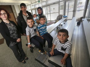 Maysoun Darweesh (left) has organized an event to show appreciation for families who have hosted refugees. The event takes place in Winnipeg today. She is standing with one refugee family that has been placed. Saturday, May 13, 2017. Chris Procaylo/Winnipeg Sun/Postmedia Network