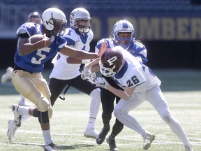 Colm Tomkins #26 (left) moves in to attempt to tackle #5 Brandon O'Connor in action during the Senior Bowl in Winnipeg. Saturday, May 13, 2017. Chris Procaylo/Winnipeg Sun/Postmedia Network