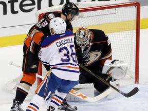 Edmonton Oilers center Drake Caggiula (36) scores past Anaheim Ducks goalie John Gibson, right, and defenseman Shea Theodore during the first period in Game 7 of a second-round NHL hockey Stanley Cup playoff series in Anaheim, Calif., Wednesday, May 10, 2017.