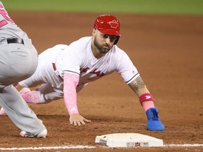 Kevin Pillar of the Blue Jays dives back safely to first base during MLB game action against the Seattle Mariners at Rogers Centre on May 13, 2017 in Toronto. (Tom Szczerbowski/Getty Images)