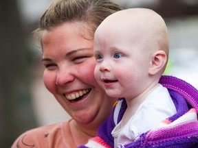 Junia Boos, 11 months old, and her mother, her mother Kandace Boos were among those who trekked to Ottawa from Kitchener-Waterloo.