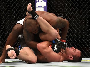 Derrick Lewis (top) grapples with Ruan Potts during UFC 184 at Staples Center on February 28, 2015 in Los Angeles. (Harry How/Getty Images)