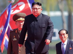 In this April 13, 2017 file photo, North Korean leader Kim Jong Un, center, is accompanied by Pak Pong Ju, right, Hwang Pyong So, second left, as he arrives for the official opening of the Ryomyong residential area, in Pyongyang, North Korea. On Sunday, North Korea test-launched a ballistic missile. (AP Photo/Wong Maye-E, File)
