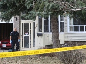 Police are pictured on March 31, 2013 at the home where cross-bow killer Li Tian Jia murdered his parents. (DAVE THOMAS, Toronto Sun)