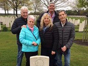 Sarnia's Carolyn Russell, far left, is pictured here at the grave of her father Oswald 'Ossie' Cameron, a Canadian soldier killed in action during the Second World War. She was only a child when her father died, but she recently travelled to the Groesbeek Canadian War Cemetery to visit her father's grave for the first time. Pictured here with her, in the back row, are husband Ross Russell and son Todd, with daughter Jody and son Scott in the front row alongside her. Handout/Sarnia Observer/Postmedia Network