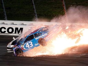 Aric Almirola (43), Danica Patrick and Joey Logano (back left) crash during the NASCAR Monster Cup race at Kansas Speedway in Kansas City, Kan., on Saturday, May 13, 2017. (AP Photo/Colin E. Braley)