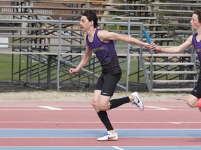 Max Mahaffy of the Lo Ellen Park Knights hands off to team mate Giordano Biondi  during the midget boys 4x100 relay Sudbury, Ont. on Wednesday May 10, 2017. The SDSSAA track and field championships take place at the Laurentian Community Track Complex on Wednesday and Thursday. Gino Donato/Sudbury Star/Postmedia Network