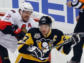 Senators defenceman Dion Phaneuf (left) checks Penguins forward Sidney Crosby in the crease during the first period of Game 1 of the NHL's Eastern Conference final in Pittsburgh on Saturday, May 13, 2017. (AP Photo/Gene J. Puskar)