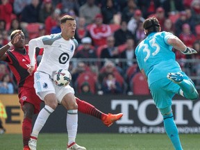 Without Chris Mavinga (left) battling for every inch, Minnesota’s Christian Ramirez doesn’t concede an own goal on Saturday. The Canadian Press