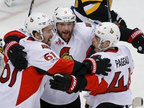 Senators forwards Jean-Gabriel Pageau (right) celebrates with teammates Mark Stone (left) and Bobby Ryan (centre) after scoring against the Penguins during the first period of Game 1 of the NHL's Eastern Conference final in Pittsburgh on Saturday, May 13, 2017. (AP Photo/Gene J. Puskar)