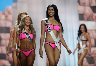 In this May 11, 2017, photo, Miss New Jersey USA Chhavi Verg competes during a preliminary competition for Miss USA in Las Vegas. Very emigrated from India with her parents. Five of the contestants vying for the Miss USA title this year were born in other countries and now U.S. citizens. (AP Photo/John Locher)