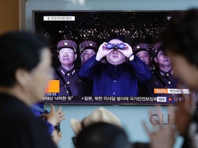 A TV news program shows a file image of North Korean leader Kim Jong Un at the Seoul Railway Station in Seoul, South Korea, Sunday, May 14, 2017. North Korea on Sunday test-launched a ballistic missile that landed in the Sea of Japan, the South Korean, Japanese and U.S. militaries said. The launch is a direct challenge to the new South Korean president elected four days ago and comes as U.S., Japanese and European navies gather for joint war games in the Pacific. (AP Photo/Ahn Young-joon)