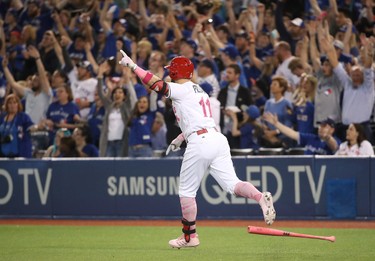 TORONTO, ON - MAY 14: Kevin Pillar #11 of the Toronto Blue Jays celebrates as he hits a game-winning solo home run in the ninth inning during MLB game action against the Seattle Mariners at Rogers Centre on May 14, 2017 in Toronto, Canada. (Photo by Tom Szczerbowski/Getty Images)