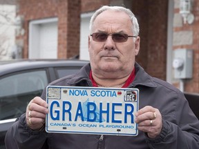 Lorne Grabher displays his personalized licence plate in Dartmouth, N.S. on Friday, March 24, 2017. THE CANADIAN PRESS/Andrew Vaughan